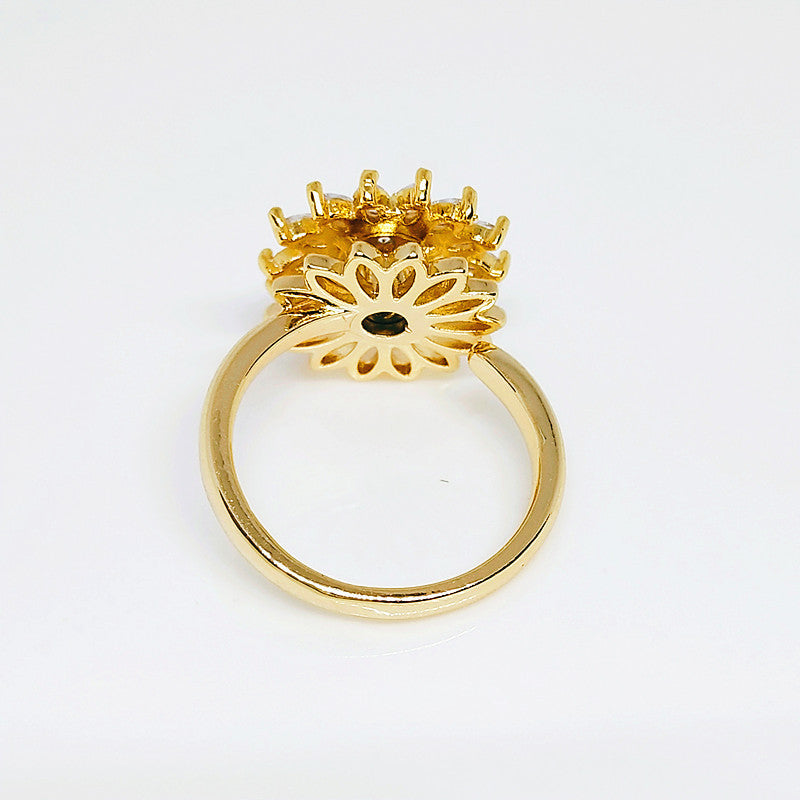 Anillo giratorio de girasol con diamantes completos