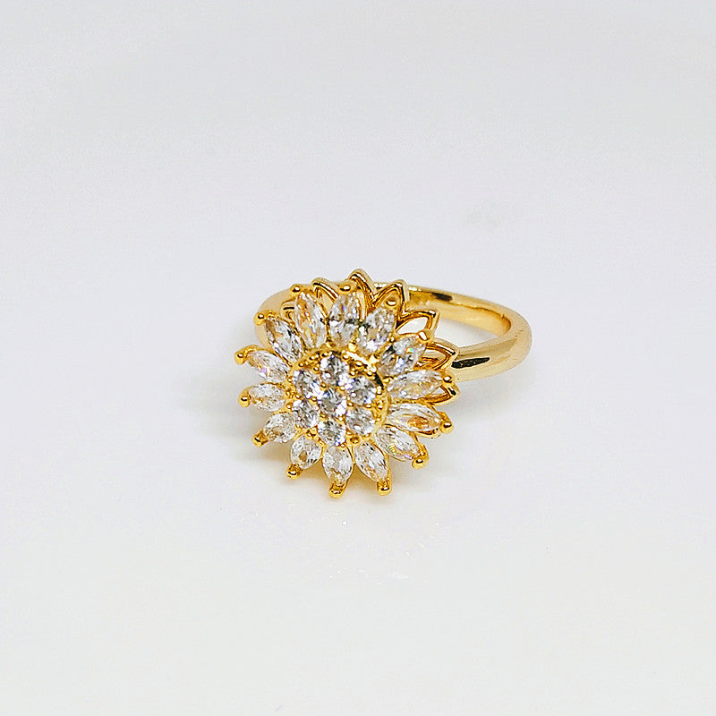 Anillo giratorio de girasol con diamantes completos