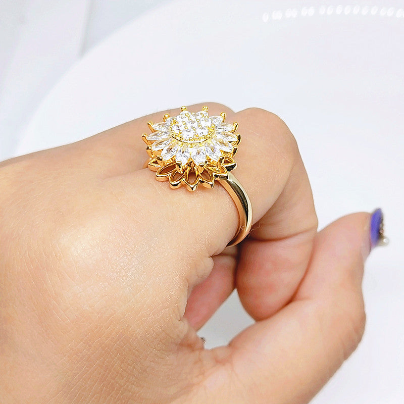 Anillo giratorio de girasol con diamantes completos